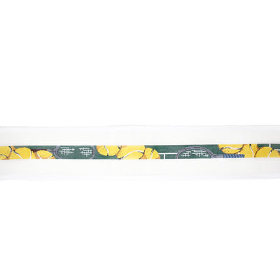 Hand-painted needlepoint belt canvas featuring a green background with yellow tennis balls, perfect for tennis lovers and sporty stitching projects
