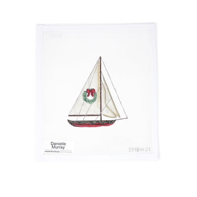 Hand-painted 18 mesh needlepoint canvas by Danielle Murray featuring a beautifully detailed sailboat yacht adorned with a holiday wreath. A perfect blend of nautical charm and Christmas spirit, ideal for finishing as a festive ornament, framed piece, or coastal holiday decor.