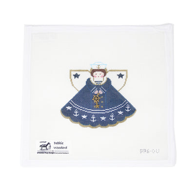 Hand-painted needlepoint canvas by Debbie Woodard Designs featuring an old-fashioned sailor angel on 18 mesh, complete with nautical details and vintage charm. Perfect for finishing as a maritime-themed ornament, framed piece, or heartfelt gift for those who love the sea or have naval ties.