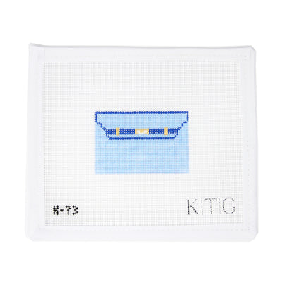 "Hand-painted 18 mesh needlepoint canvas by K.T.G Needlepoint, inspired by the Hermès Kelly Cut Pochette clutch in a blue chambray colorway. A fashion-forward and beginner-friendly design, perfect for finishing as a clutch, tray insert, or chic decorative accessory.