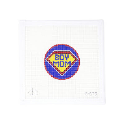 Hand-painted needlepoint canvas by Doolittle Stitchery on 18 mesh, featuring a 3" royal blue round with a Superman-style shield that says “Boy Mom.” A fun and empowering design perfect for finishing as an ornament, keychain, or mini frame—great for Mother’s Day or celebrating a super mom of boys.
