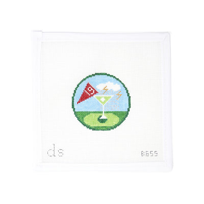 Hand-painted needlepoint canvas on 18 mesh featuring a fun “19th Hole” round design with a martini glass in place of the golf flag pole, and a flag inside the drink marked “#19.” Add metallic threads for extra sparkle! Perfect for finishing as a playful ornament, coaster, or gift for golf lovers who enjoy celebrating post-round.