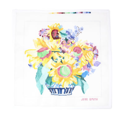 Hand-painted needlepoint canvas by Jean Smith featuring a vibrant sunflower bouquet with rich yellows and greens, 14" square on 13 mesh—perfect for finishing as a bold statement pillow, cheerful framed artwork, or a sunny decorative tray.