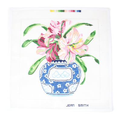 Hand-painted needlepoint canvas featuring a blooming amaryllis arranged in an elegant blue and white vase—perfect for finishing as a sophisticated pillow, framed artwork, or decorative tray for floral lovers on 13 mesh.