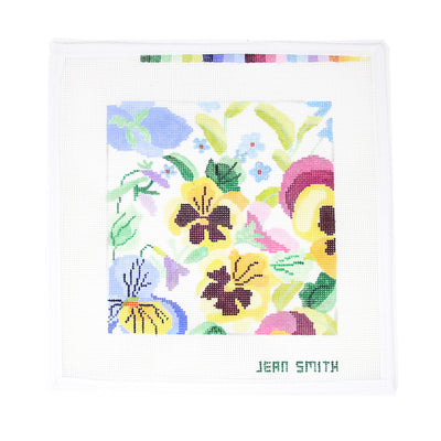 "Hand-painted needlepoint canvas featuring a square arrangement of vibrant pansies in rich purples, yellows, and blues—perfect for finishing as a floral pillow, coaster set, or framed springtime accent.