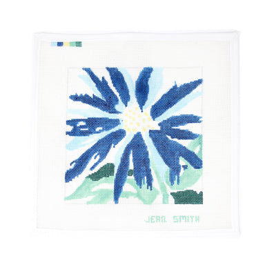Hand-painted needlepoint canvas featuring a bold blue splash-style flower with abstract brushstroke details—ideal for finishing as a modern pillow, framed art piece, or decorative tray.