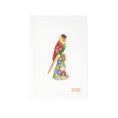 Hand-painted needlepoint canvas featuring a colorful bird perched on a floral pedestal, designed by Stitching with Stacey. This vibrant design on 13 mesh canvas is perfect for spring or tropical-themed stitching. Ideal for finishing as a door hanger, small pillow insert, or framed as whimsical wall art.