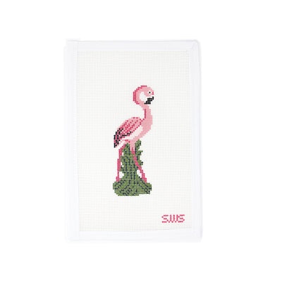 Hand-painted needlepoint canvas featuring a pink flamingo  standing on green grass, designed by Stitching with Stacey. This vibrant design on 13 mesh canvas is perfect for spring or tropical-themed stitching. Ideal for finishing as a door hanger, small pillow insert, or framed as whimsical wall art.