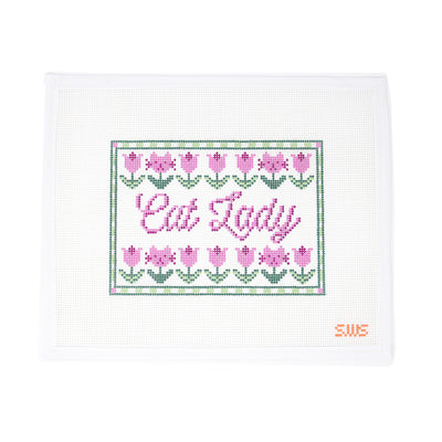 Cat Lady" needlepoint canvas featuring playful lettering surrounded by blooming tulips and framed with a cheerful green border, hand-painted on mesh. A charming design perfect for finishing as a decorative sign, door hanger, framed piece, or a small pillow for your favorite feline enthusiast 13 mesh.