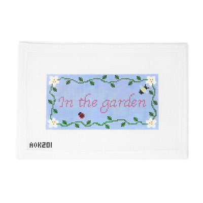 Hand-painted needlepoint canvas on 18 mesh featuring the phrase “In the Garden” in elegant cursive, bordered with trailing vines, colorful flowers, buzzing bees, and sweet ladybugs. A whimsical and nature-inspired design perfect for finishing as a decorative sign, framed piece, or garden-themed pillow.