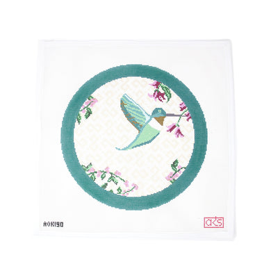 Hand-painted needlepoint canvas, 12" round on 13 mesh, featuring a vibrant hummingbird pollinating colorful flowers. A beautiful nature-inspired design perfect for finishing as a striking pillow or elegant wall hanging to bring a touch of the outdoors inside.