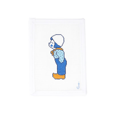 Hand-painted needlepoint canvas of a vintage-style Dutch boy on 18 mesh, perfect for finishing as a charming ornament or nostalgic holiday decor.