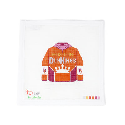 Boston Dunkings jacket needlepoint canvas on 18 mesh, designed by Froopy Designs in collaboration with The Collection. Features a vibrant design of a classic varsity jacket with "Boston Dunkings" across the back in bold lettering. Perfect for finishing as a standout patch, framed piece, or trendy pillow insert for sports fans or Dunkin’ lovers.