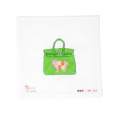 Playful needlepoint canvas featuring a pig cozily wrapped in an Hermès blanket, perched atop a green Birkin bag. Hand-painted on 18 mesh, this quirky and chic design is perfect for finishing as a statement pillow, framed artwork, or a fashion-forward tray with a touch of humor by Froopy Designs