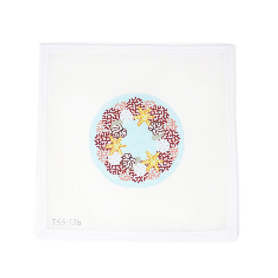 Hand-painted 18 mesh round needlepoint canvas by Vallerie Needlepoint Designs, featuring a tropical holiday wreath made of coral and starfish. Custom-designed and ideal for finishing as a festive ornament, this coastal-inspired piece blends holiday spirit with a beachy twist—perfect for tropical decor or seaside celebrations