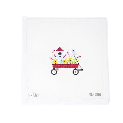 "Hand-painted 18 mesh needlepoint canvas featuring a child's red wagon filled with colorful spring florals. Custom-designed by Vallerie Needlepoint Designs and perfect for finishing as a seasonal ornament or decorative accent. A cheerful design ideal for Easter, springtime decor, or children’s keepsakes