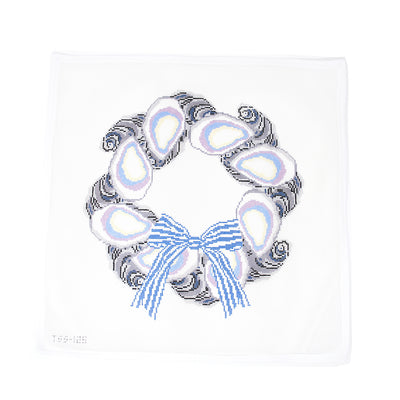 Hand-painted 18 mesh needlepoint canvas by The Salty Stitcher x Vallerie Needlepoint Designs featuring a large holiday wreath made of oysters, accented with a blue and white striped bow. A nautical take on festive decor, perfect for finishing as a statement ornament, door hanger, or coastal Christmas accent