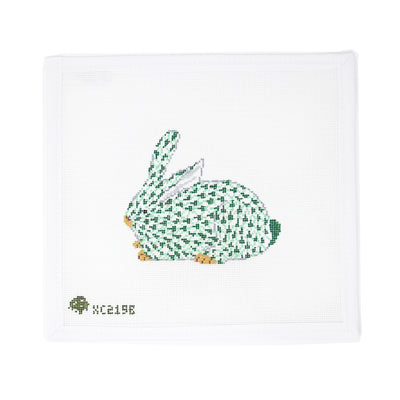 Hand-painted needlepoint canvas of a green Herend-style bunny on 18 mesh, featuring the iconic fishnet pattern. A charming design ideal for finishing as a spring ornament, Easter decoration, or a framed piece for a sophisticated nursery or tabletop vignette.