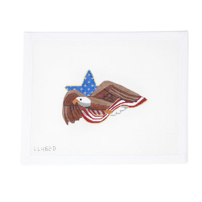 Needlepoint canvas of a flying bald eagle in front of a background featuring a star and American flag design. Hand-painted in a patriotic red, white, and blue color scheme.